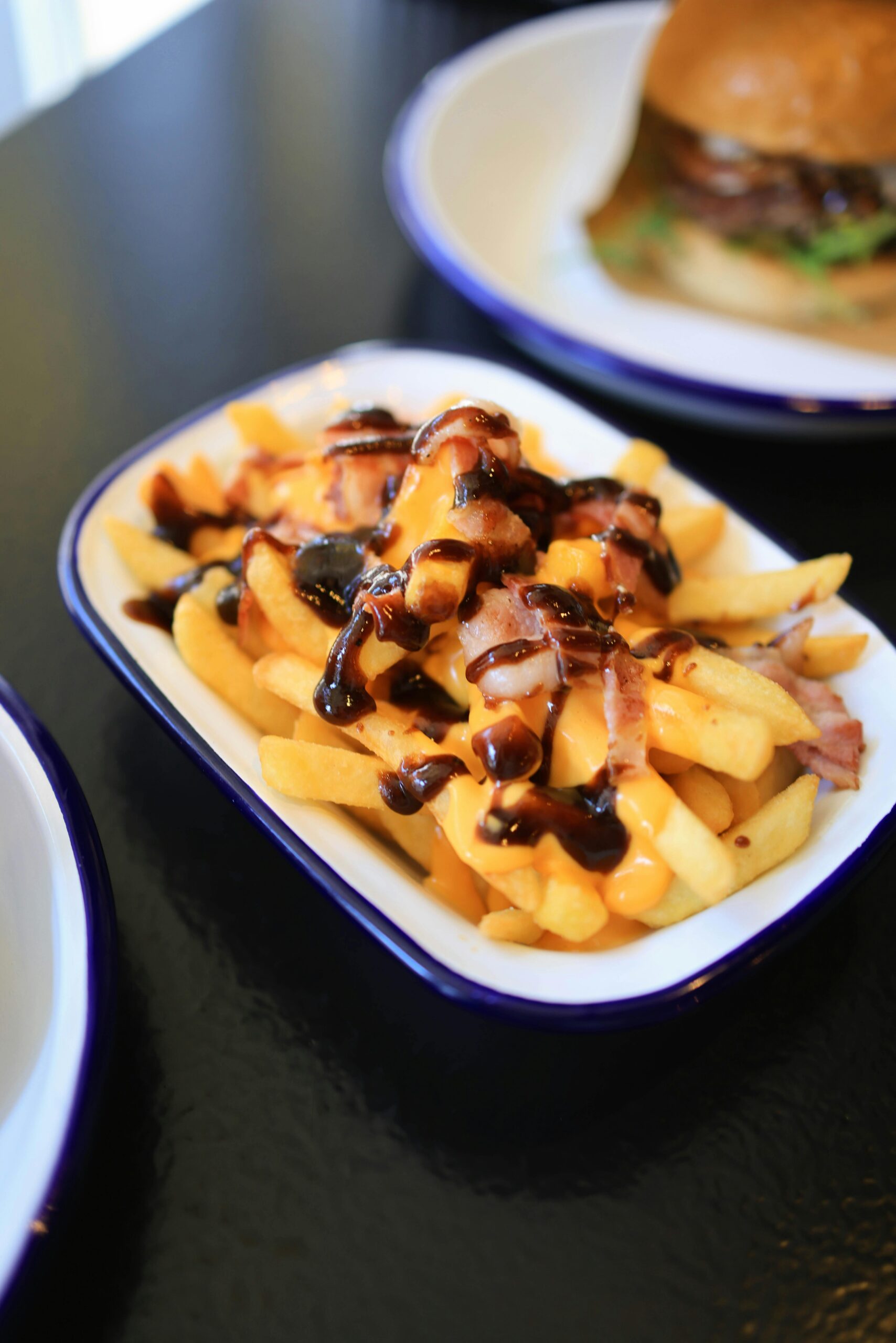 Texas Roadhouse Cheese Fries — thick-cut steak fries smothered in melted cheese and bacon bits